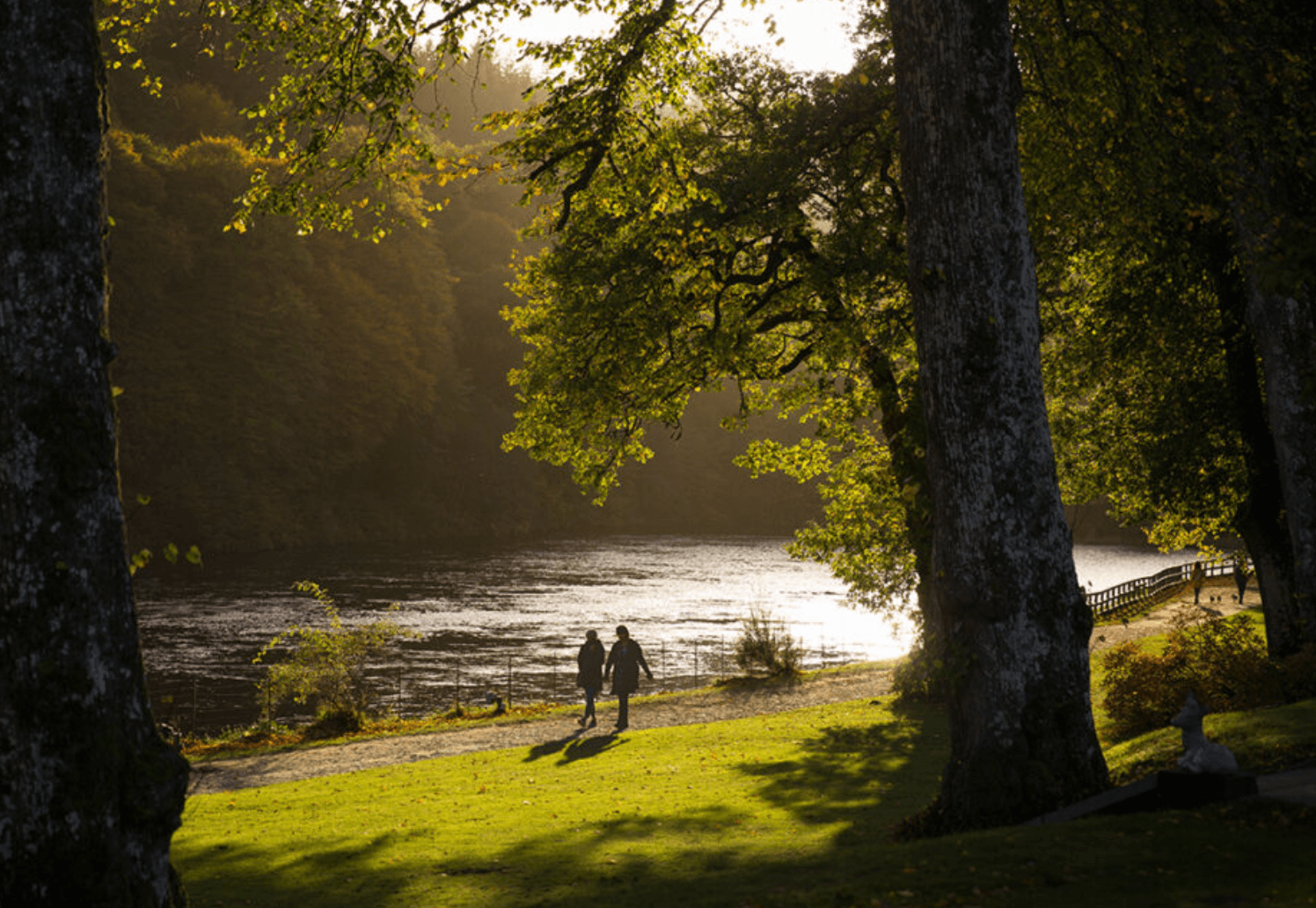 A couple enjoying a scenic walk in the Dunkeld estate