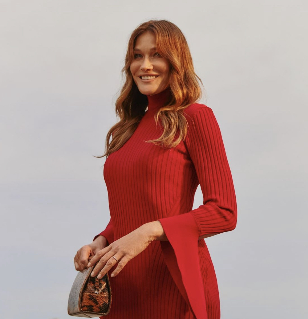 The Italian singer and model posing in a red dress.