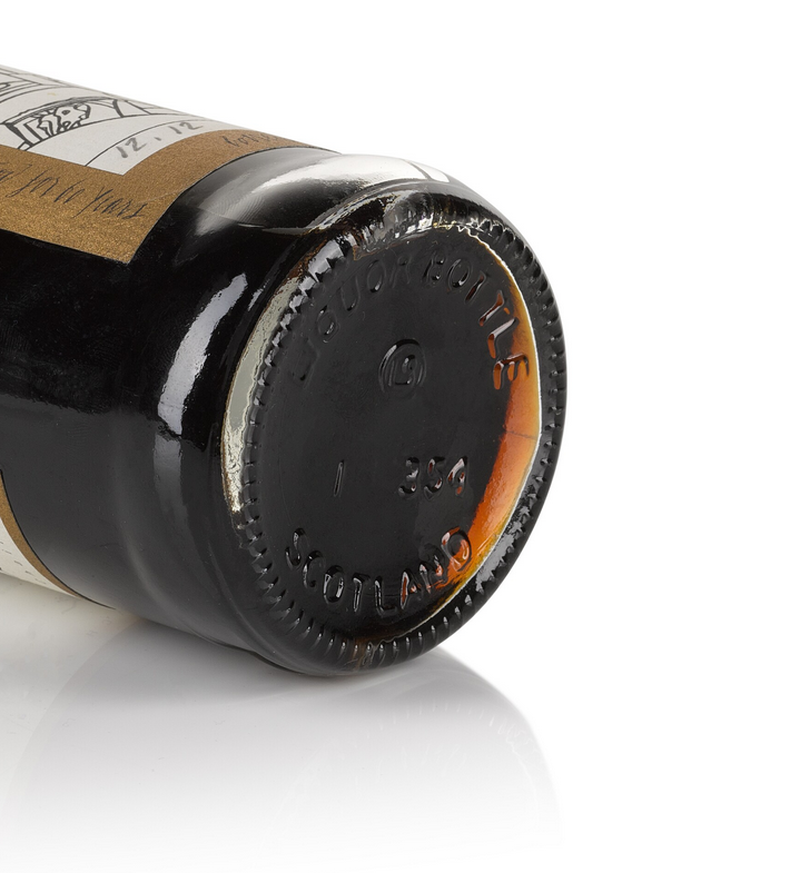 A close-up of the whisky bottle’s base