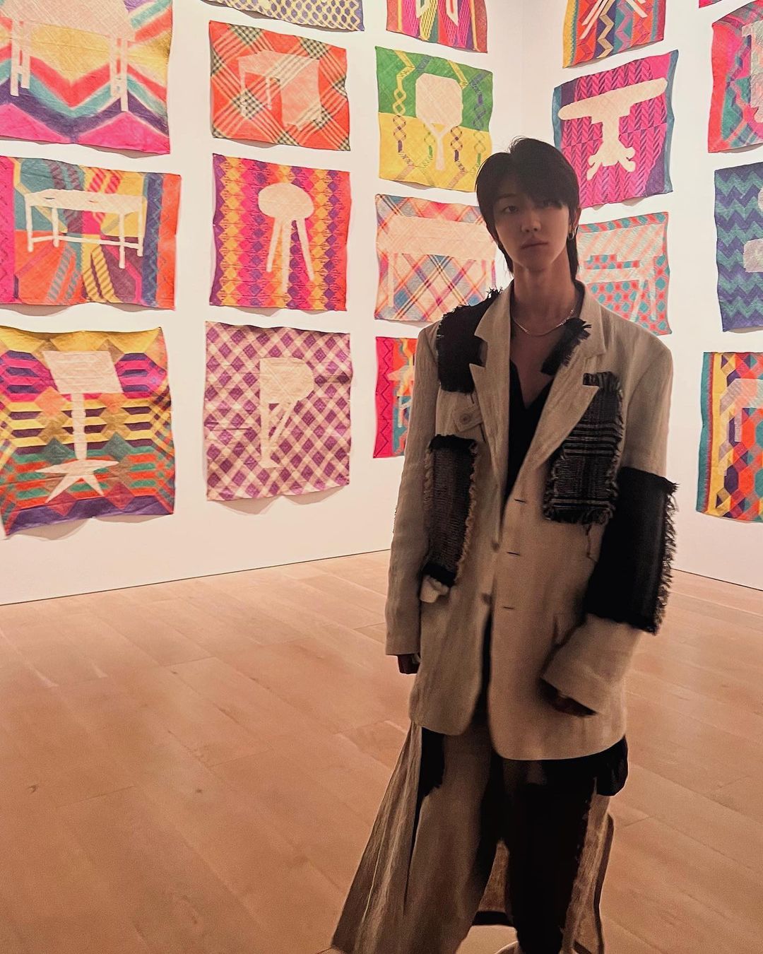 The8 at an art exhibit