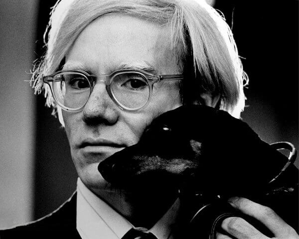 Andy Warhol with Archie, his pet Dachshund.