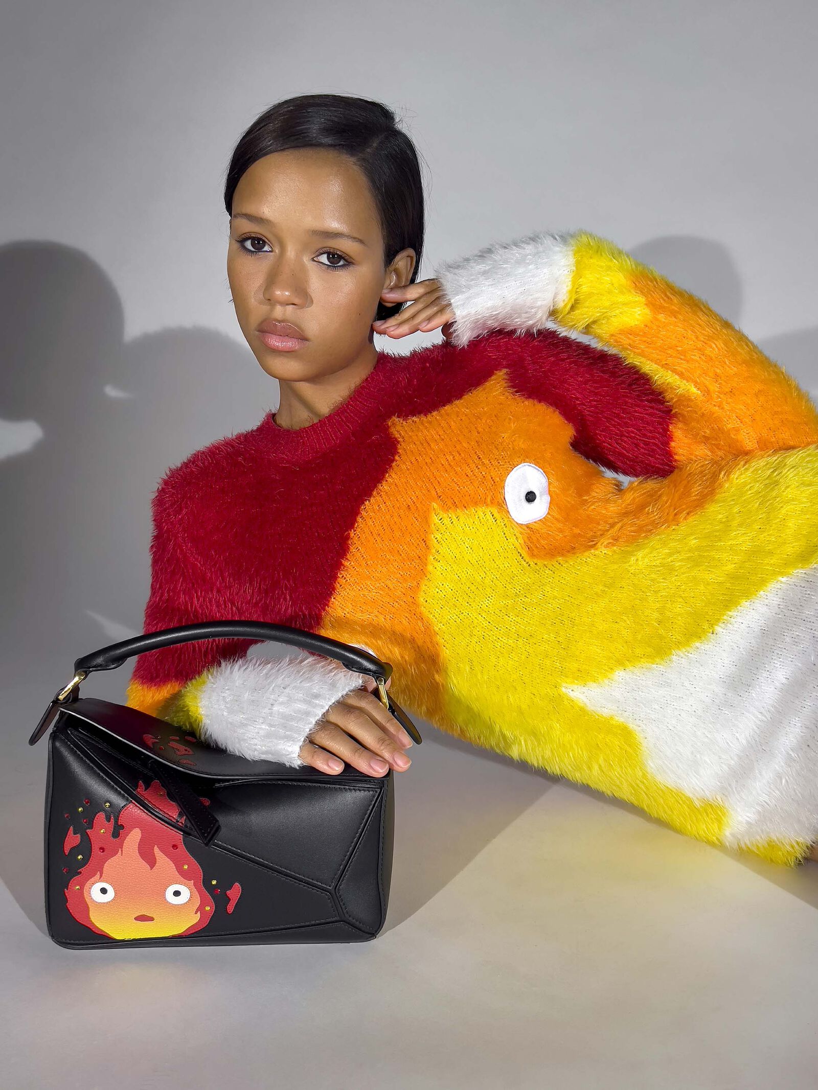 A Calcifer bag and sweater
