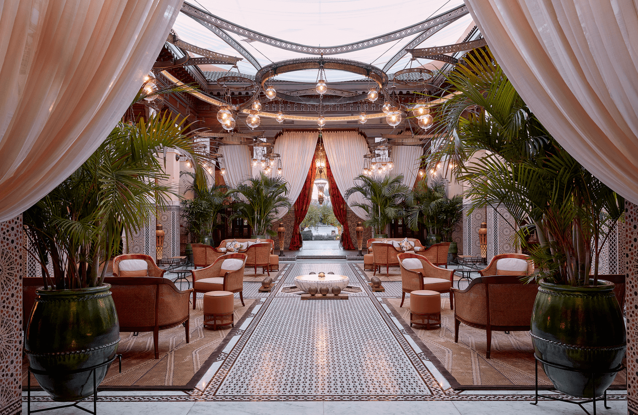 Extraordinary mozaic pieces, cedar wood ceilings, stunning furniture, and billowing white drapes fill the patio lobby