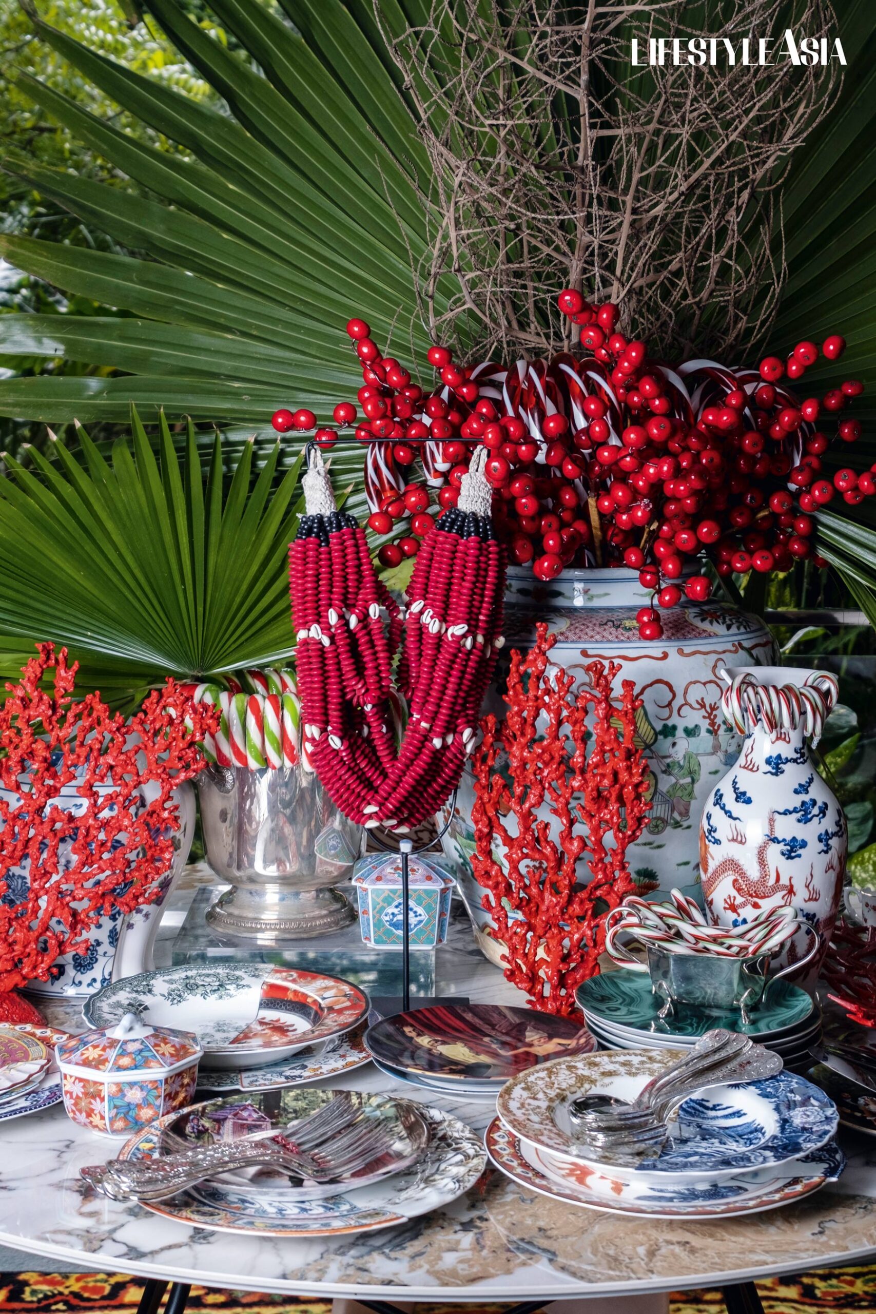 Her plate and cutlery selection includes pieces from Seletti’s Hybrid series with both Oriental and European motifs, a vintage Hans Christian Andersen porcelain, vintage green malachite dishes from L’Objet, and flatware designed by Marcel Wanders for Christofle.