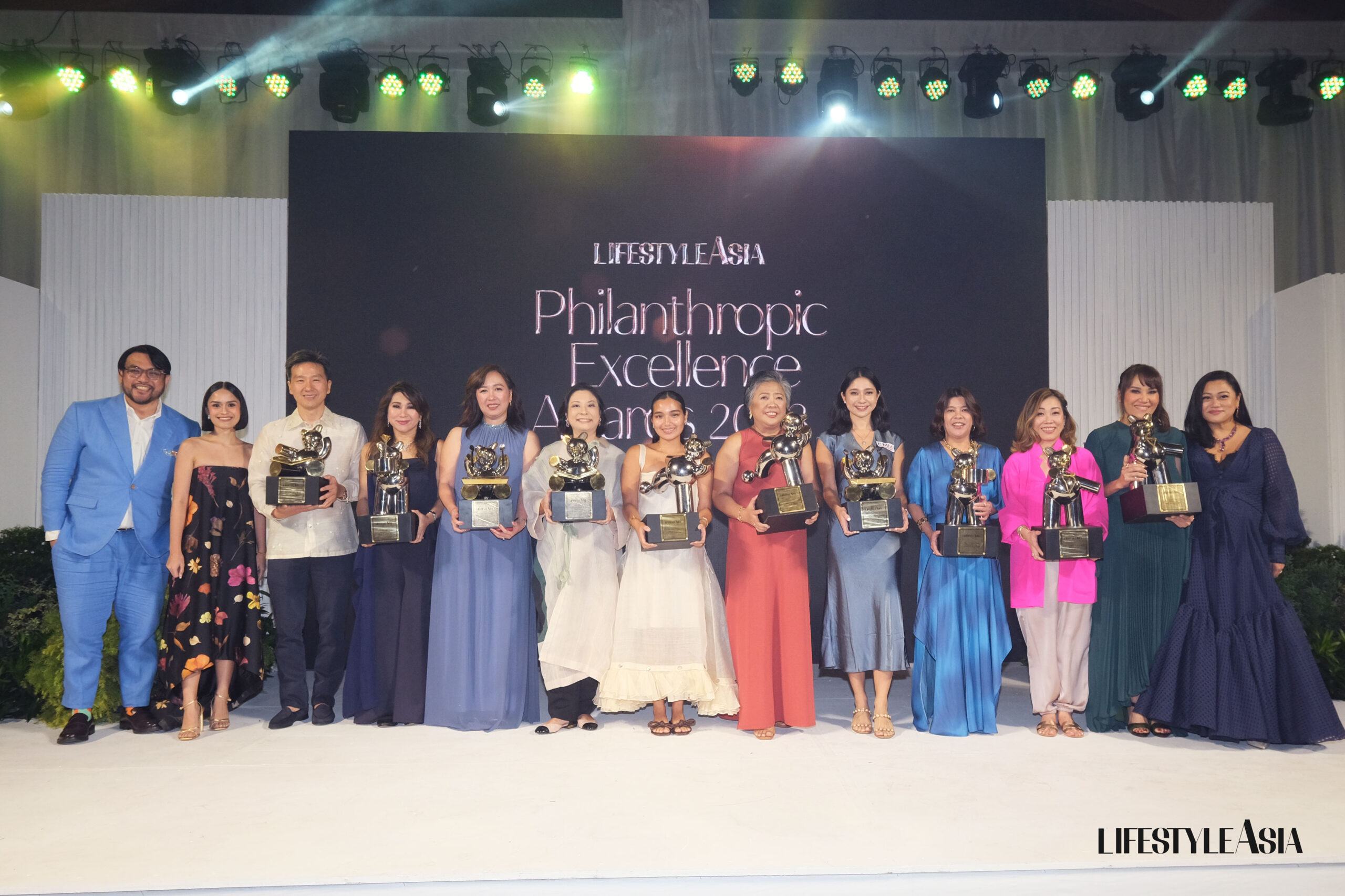 The gala awardees proudly holding the Philanthropic Excellence Awards trophies by Nixxio Castrillo