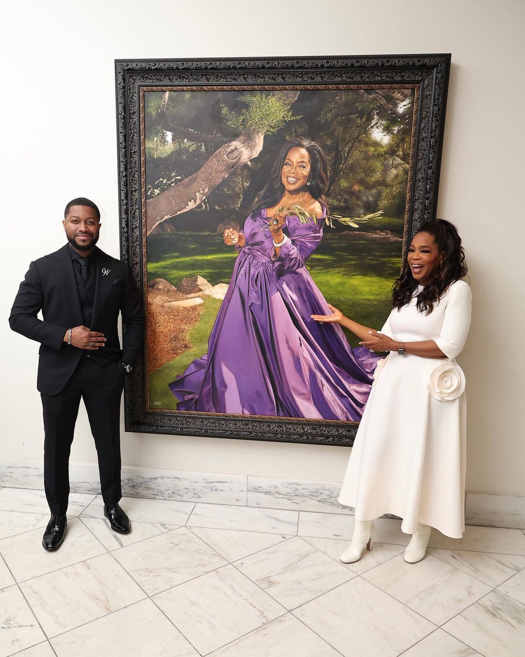 Shawn Michael Warren and Oprah Winfrey posting beside her new portrait