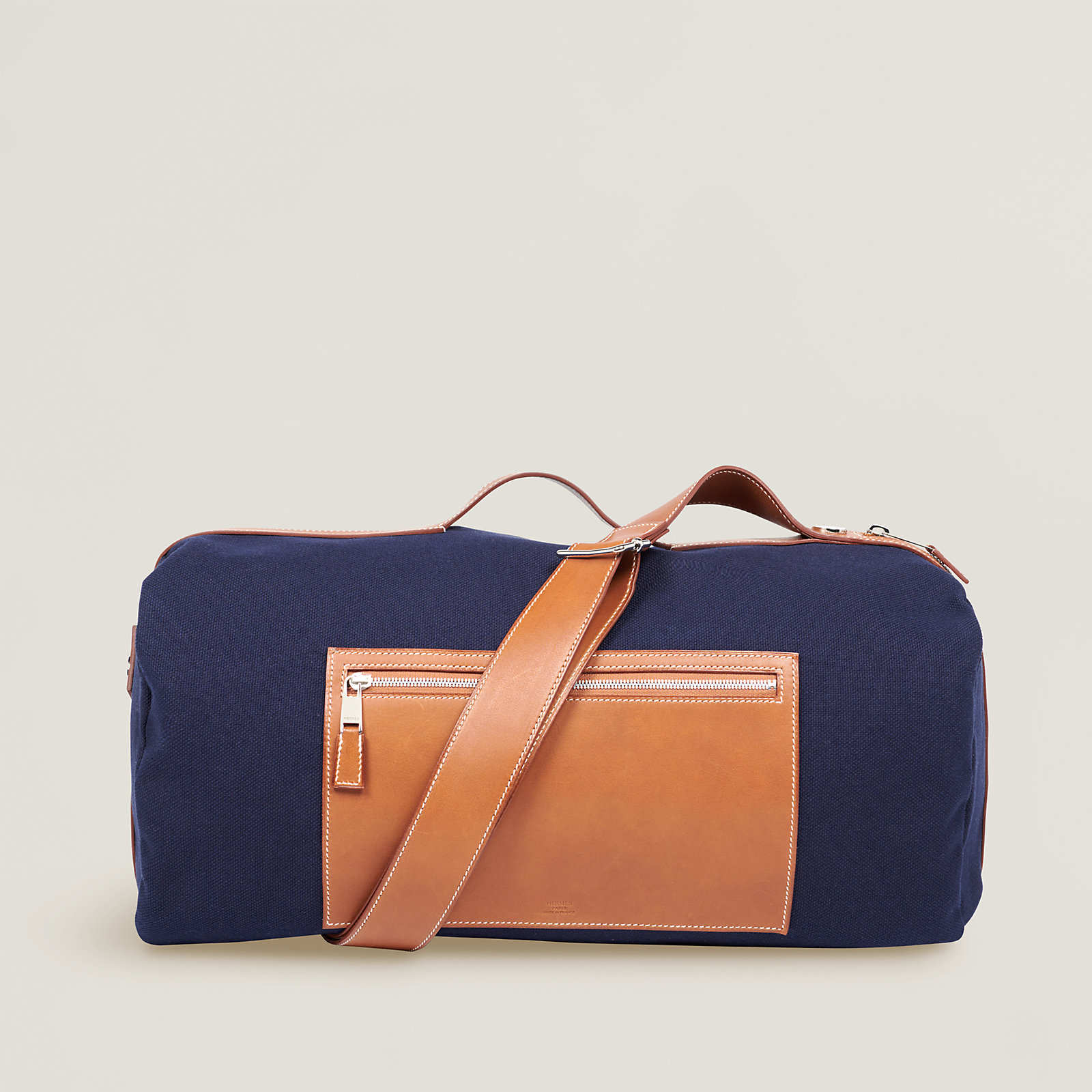 The Hermès Odyssee Terre Duffle Bag in "Bleu Marine/Gold"
