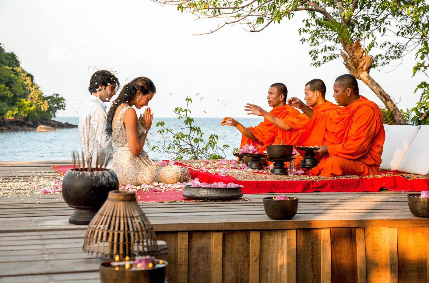 A couple receiving a monk blessing in Song Saa