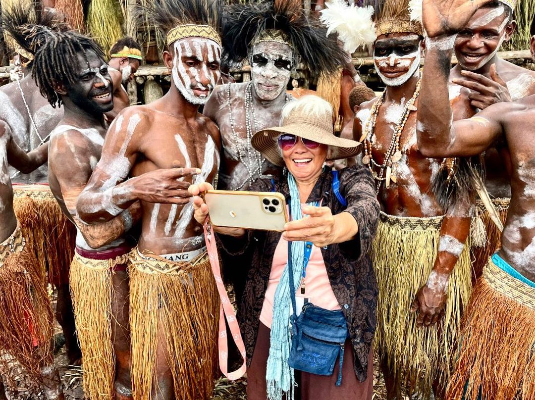 Luisa Yu with members of the Asmat tribes in New Guinea