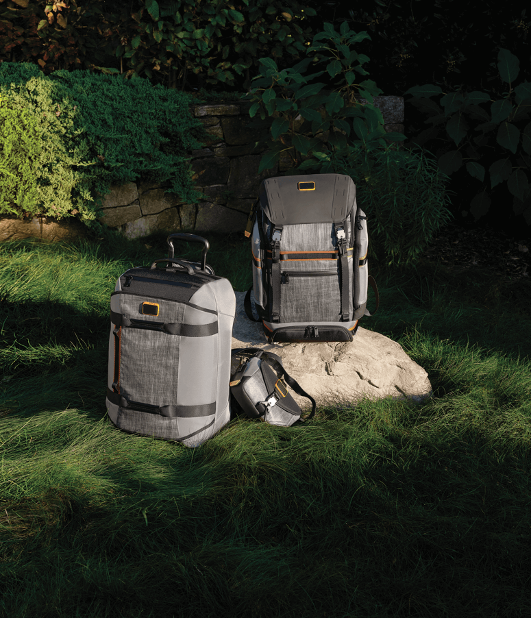 L-R: Alpha Bravo Expedition Backpack in Steel; Compass Crossbody in Steel; Wheeled Duffel in Steel