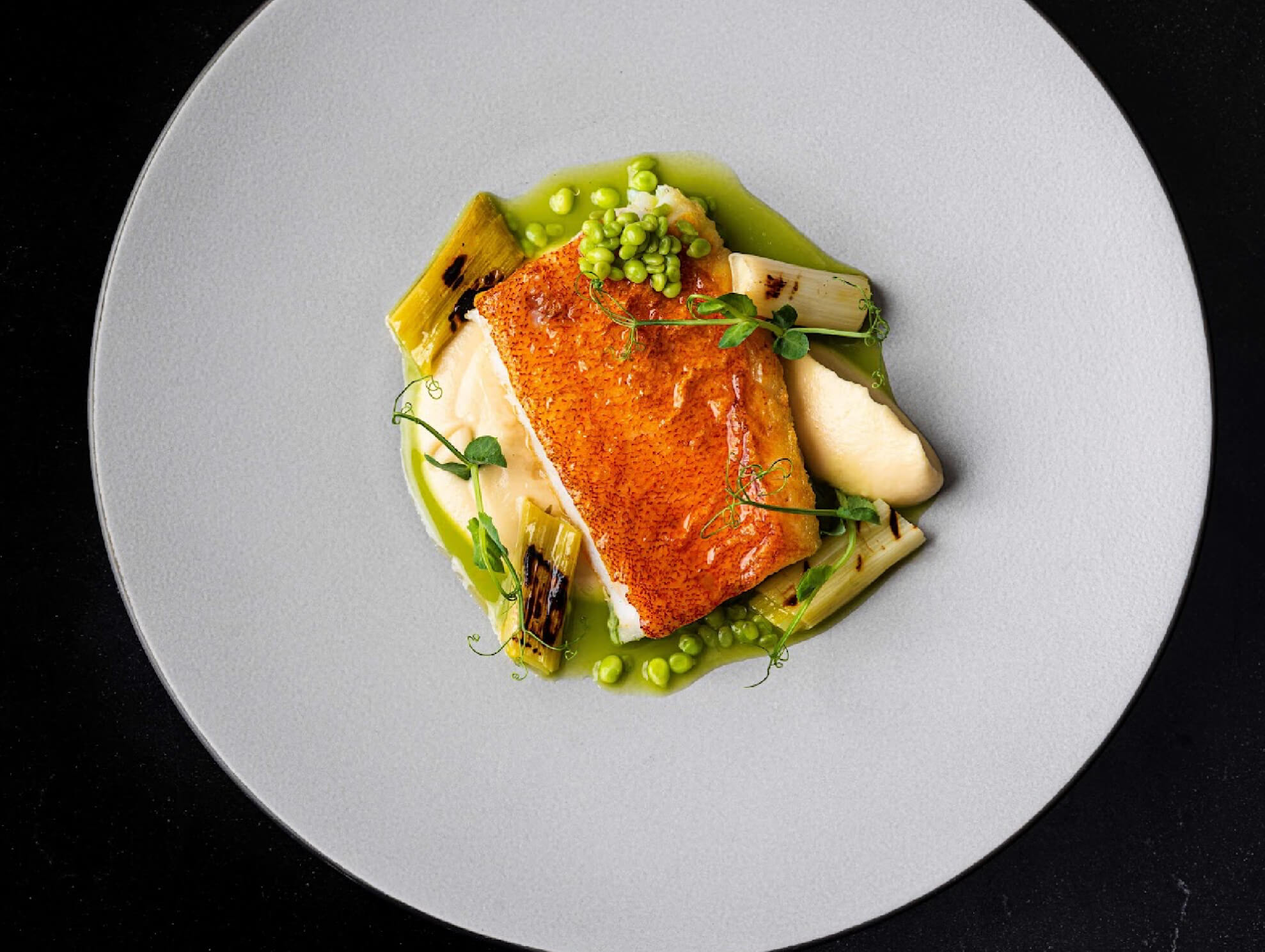 Lapu-Lapu a la Plancha (Grouper fillet, celeriac puree, cauliflower toffee, grilled leeks and snow peas)