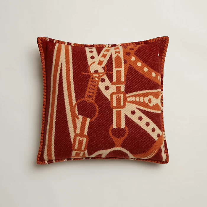 LEFT: Hérmes’ Grand Tralala pillow; RIGHT: Selle Imaginaire change tray