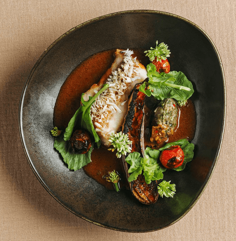 LEFT: Local Tile Fish with Crispy Scales ; RIGHT: Pacific Halibut