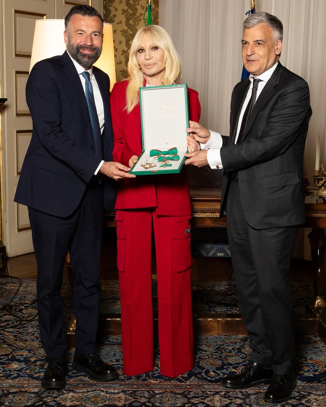 Donatella Versace receiving the order of merit