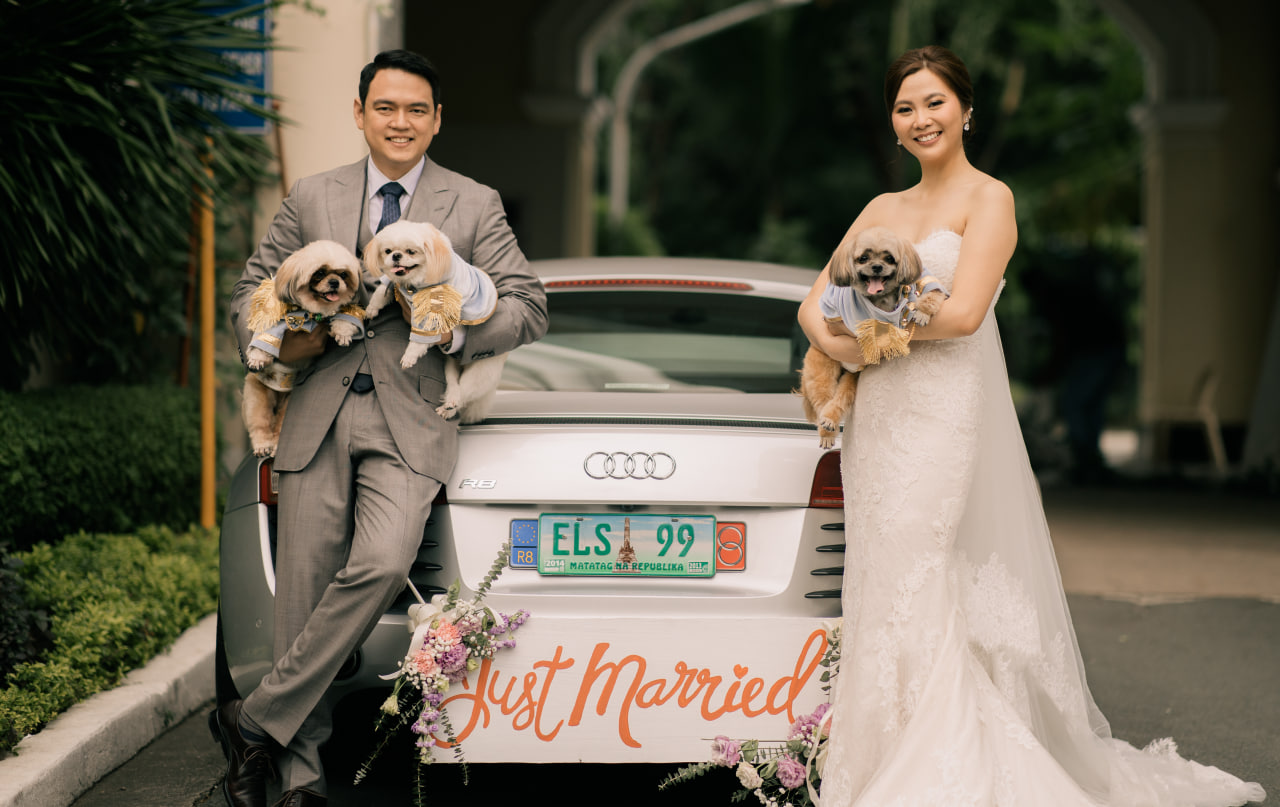 The newlyweds with their three dogs, Mico, Mochi, and Milo