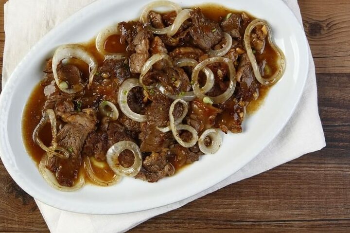TOP LEFT: Bistek Tagalog ng Kano. TOP RIGHT: Crispy Patang Bawang. BOTTOM LEFT: Tilapia with Sweet Plum Sauce. BOTTOM RIGHT: Sisig Fried Rice.