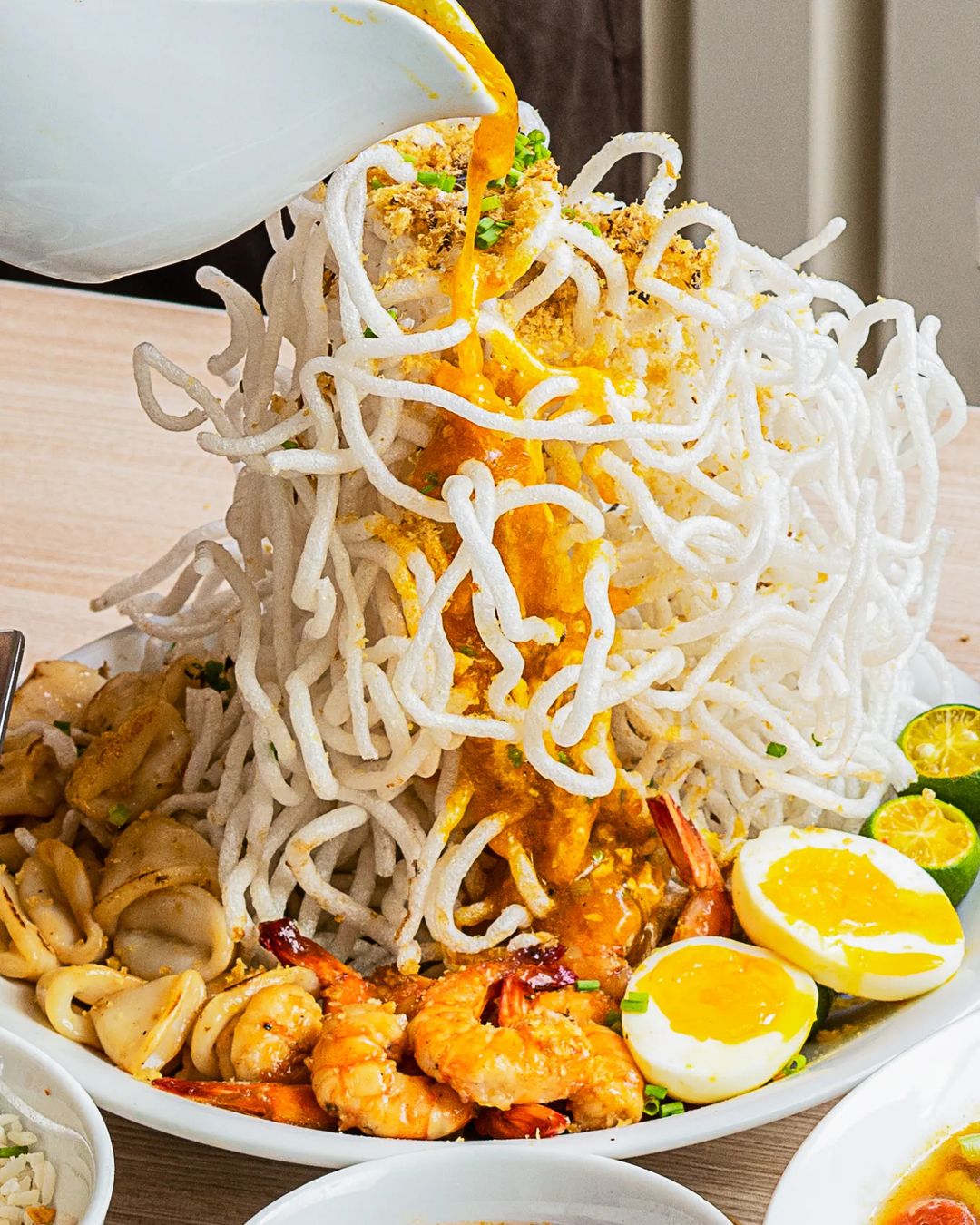 TOP LEFT: Sinigang na Beef Short Rib & Watermelon. TOP RIGHT: Lumpiang Ubod. BOTTOM LEFT: Breakfast favorites (Super Arroz Caldo, Chocolate Champorado, Ube Champorado)