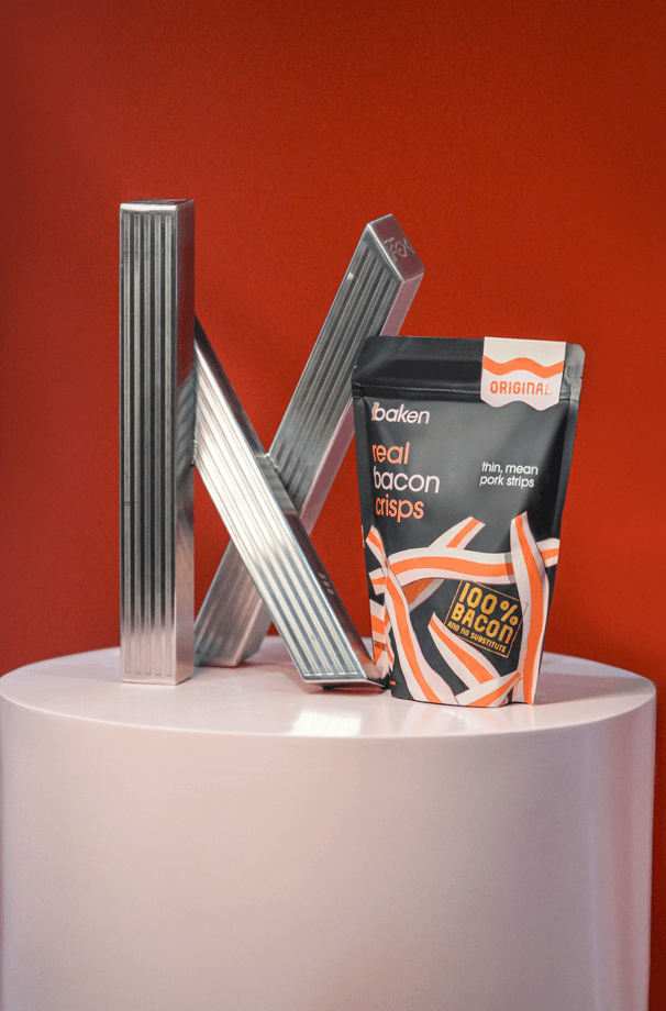 Baken's Real Bacon Crisps next to its 2024 Katha Awards trophy