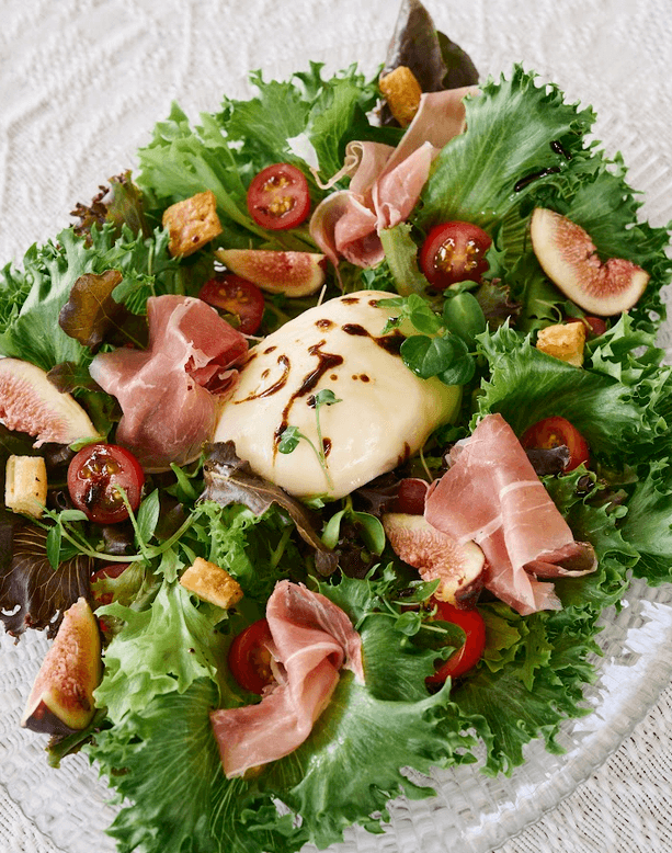 TOP LEFT: Fresh Salad with Buratta, Figs, and Prosciutto. TOP RIGHT: Grilled Chicken. BOTTOM LEFT: Dessert Tower Merienda. BOTTOM RIGHT: Caldereta.