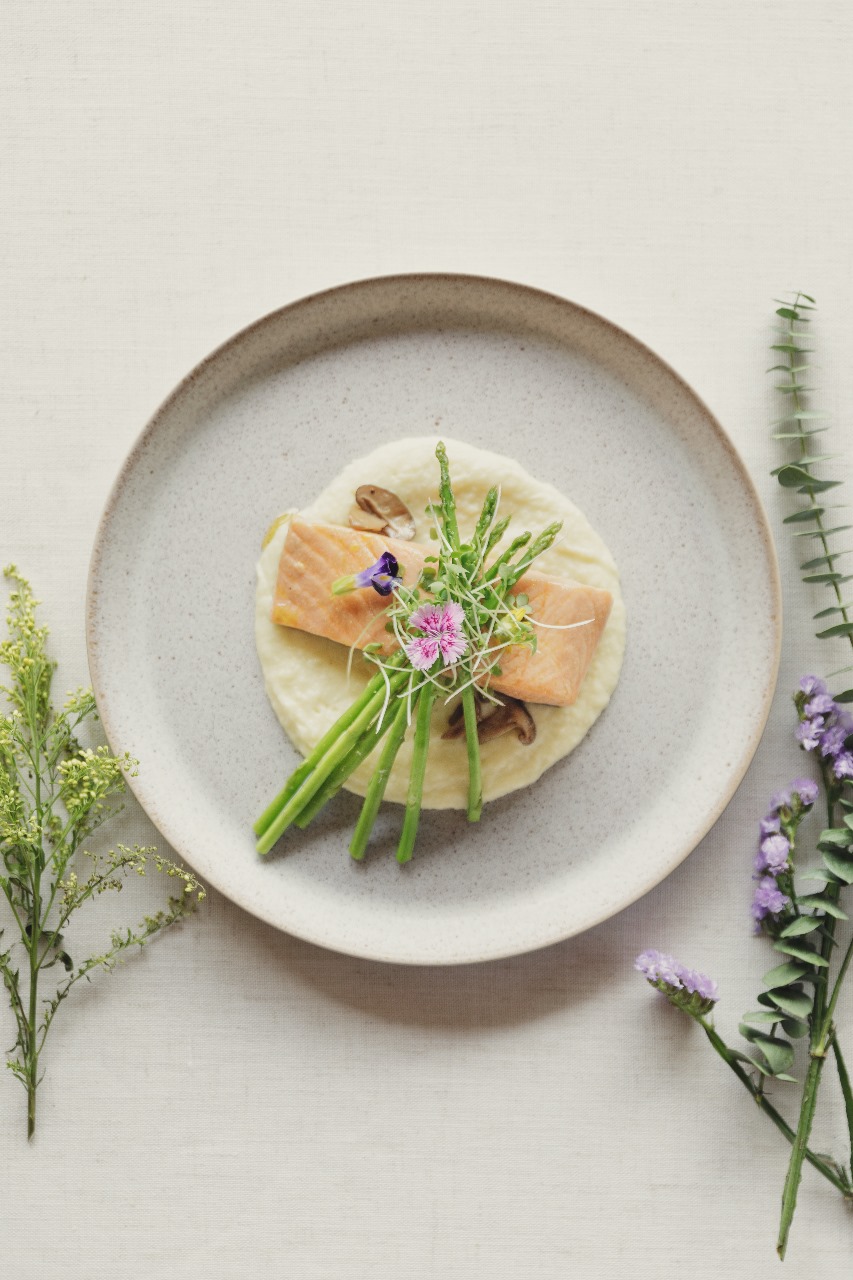 TOP LEFT: USDA Beef Wellington and Lobster Tail. TOP RIGHT: Mango Panna Cotta. BOTTOM LEFT: Poached Salmon with Potato Puree and Asparagus. BOTTOM RIGHT: Corn Chowder with Lavash.