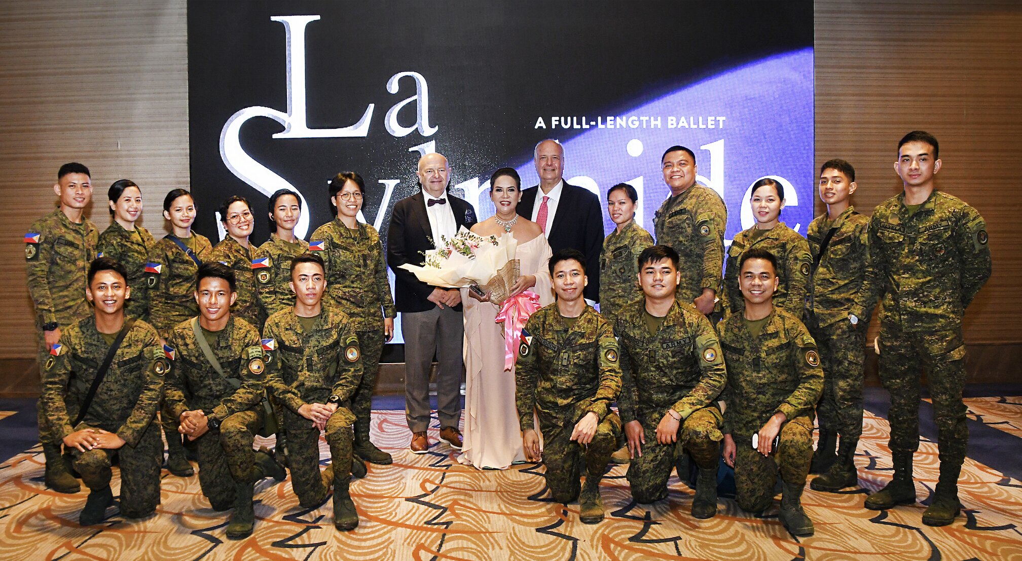 Ballet Philippines president Kathleen Liechtenstein, Einer Haveland, and Lior Liechtenstein with members of the Philippine Army