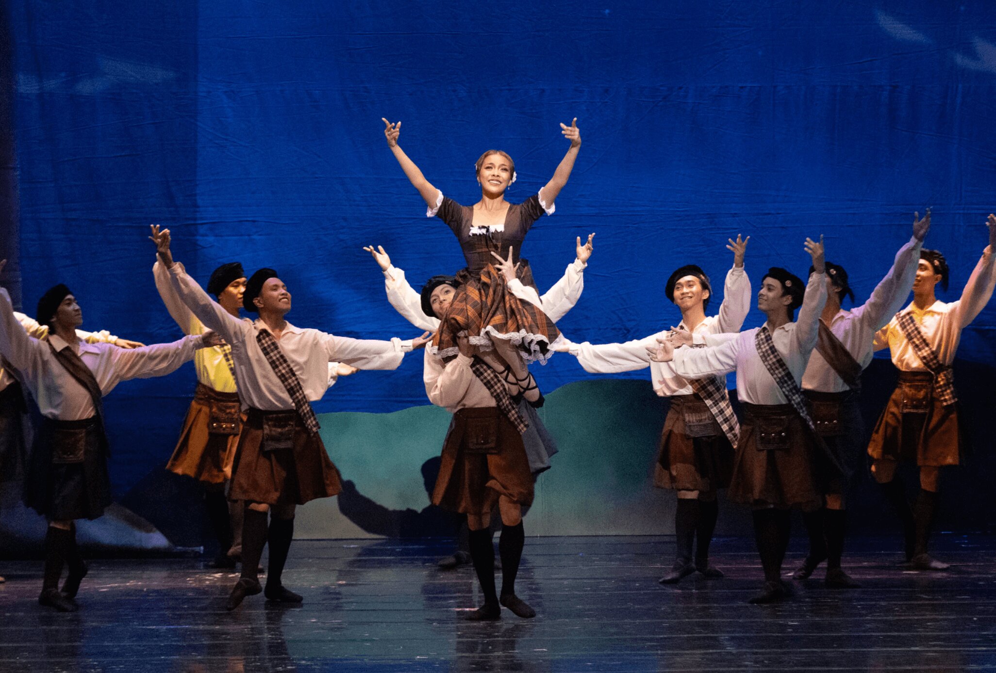 Principal dancer Nicole Barroso, who plays Effie, in the middle of a lively dance