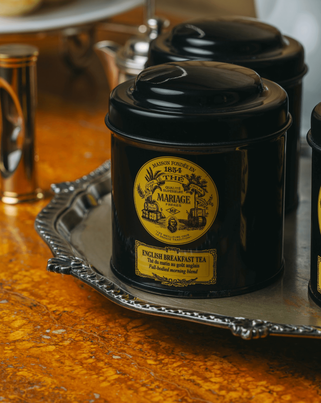 LEFT: English Breakfast Tea at Lusso. RIGHT: Finger sandwiches of goat cheese and cucumber; deviled egg and watercress; tuna with homemade mayonnaise and potato crisps; and pancetta, lettuce, and tomato.