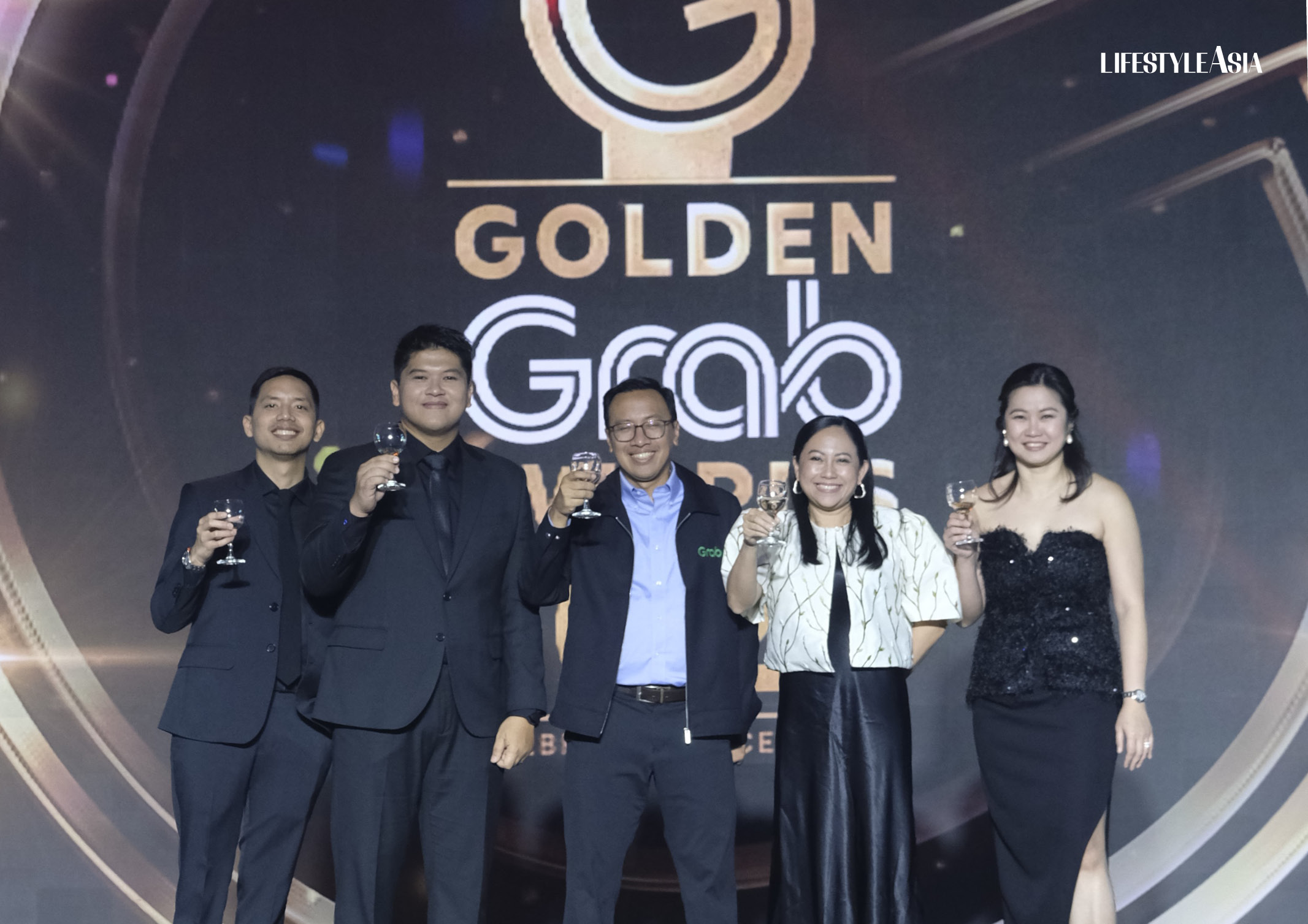 Key executives from Grab Philippines give a toast to excellence and growth