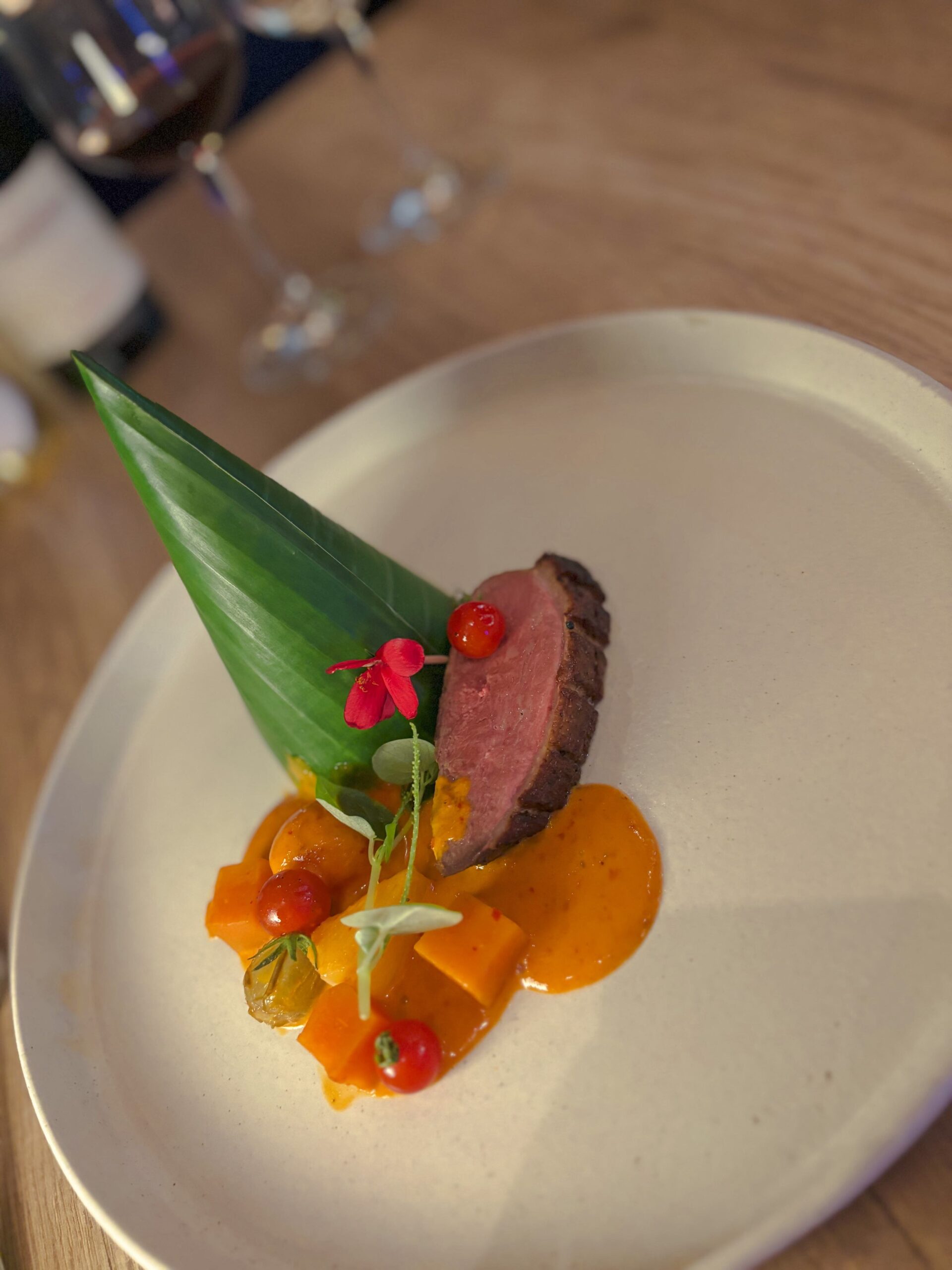 Roasted duck with cherry tomatoes, pineapple, grapes, and sweet potatoes 