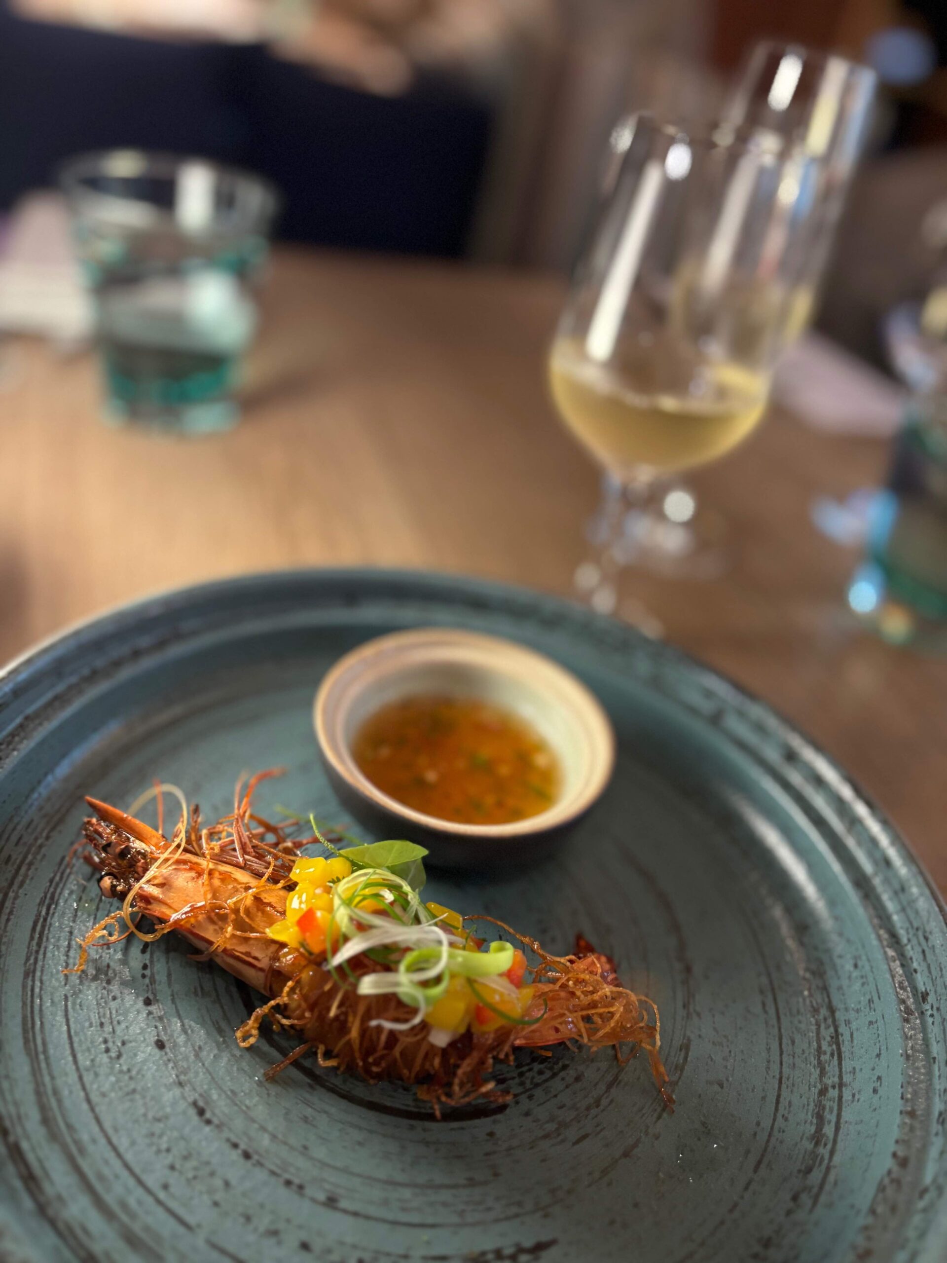 Goong Sarong, a Thai style fried prawn wrapped in noodles and sweet chili sauce 