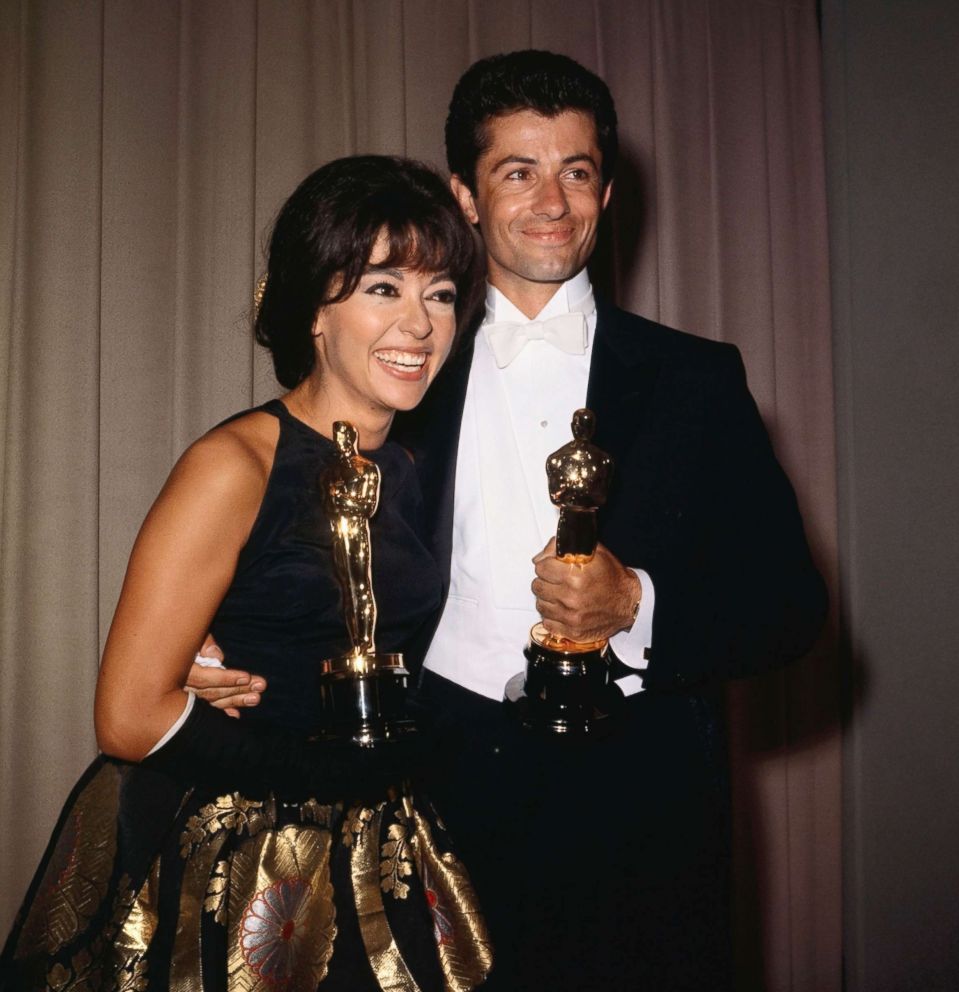 Rita Moreno wearing her Pitoy Moreno gown in 1962, alongside fellow Oscar winner and co-star George Chakiris