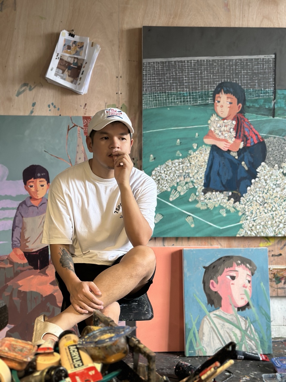 TRNZ accompanied by his paintings