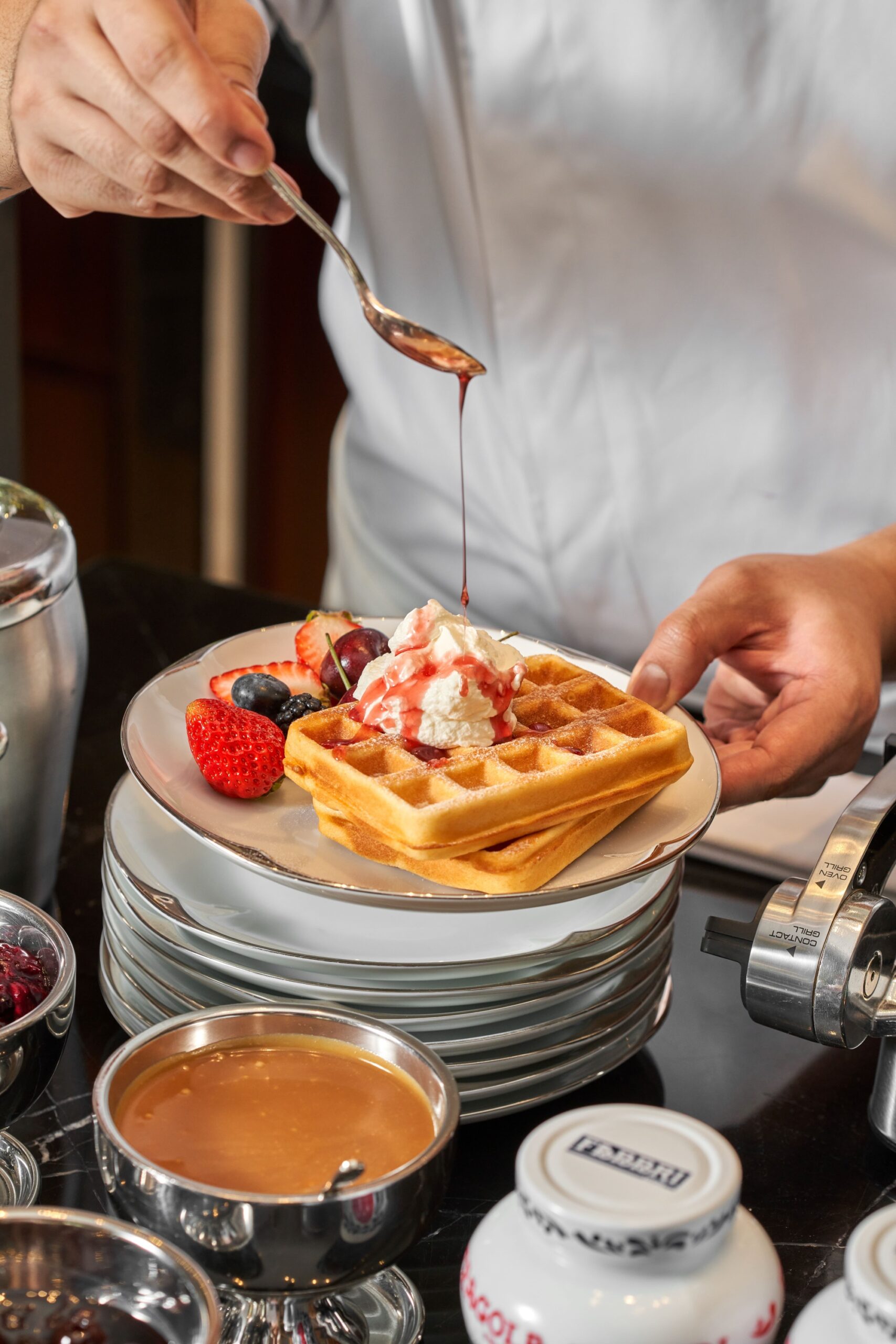 Waffles with Amarena Fabbri compotse, vanilla chantilly, chocolate and caramel sauce