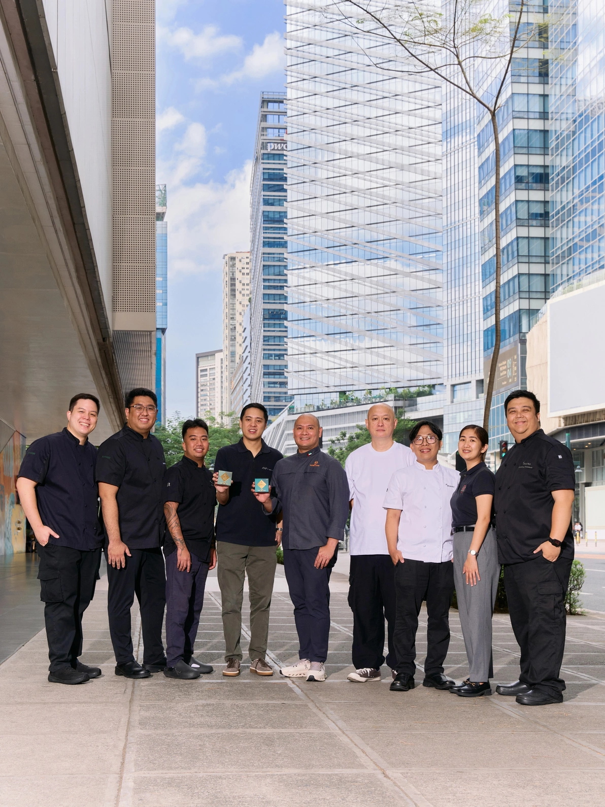 A F Hospitality Founder Amado Fores (fourth from left) and Chef Nouel Catis (fifth from left) with their team