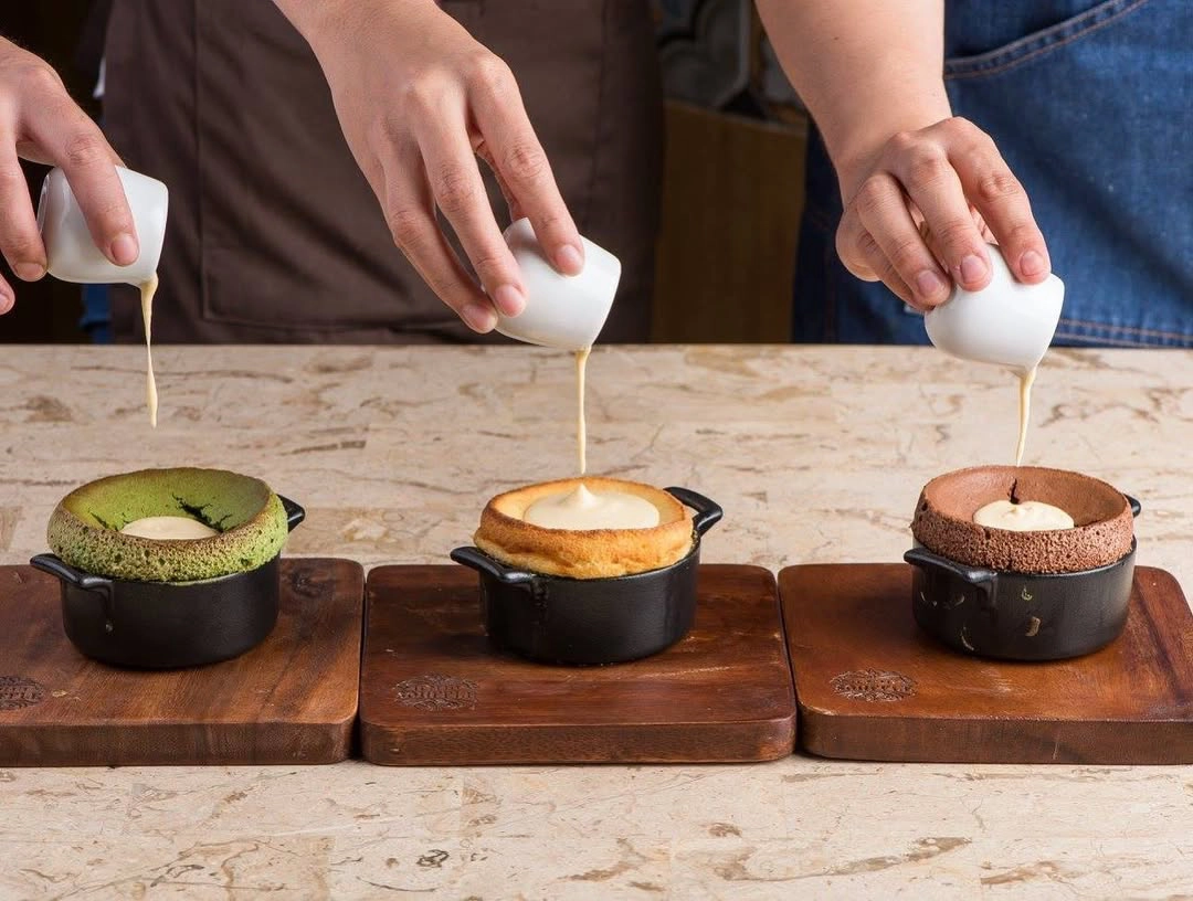 Matcha, vanilla, and dark chocolate soufflé at Le Petit Soufflé food spots closed