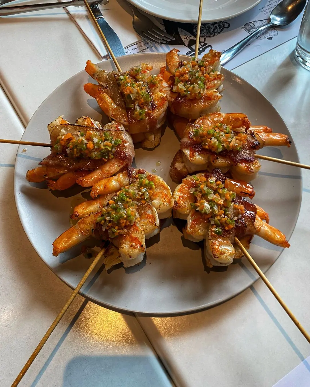 New menu items from Bar Pintxos: Matrimonio (vinegar marinated anchovy served with pepper on toast); Brocheta De Gambas Y Papada (grilled prawn and bacon skewer)