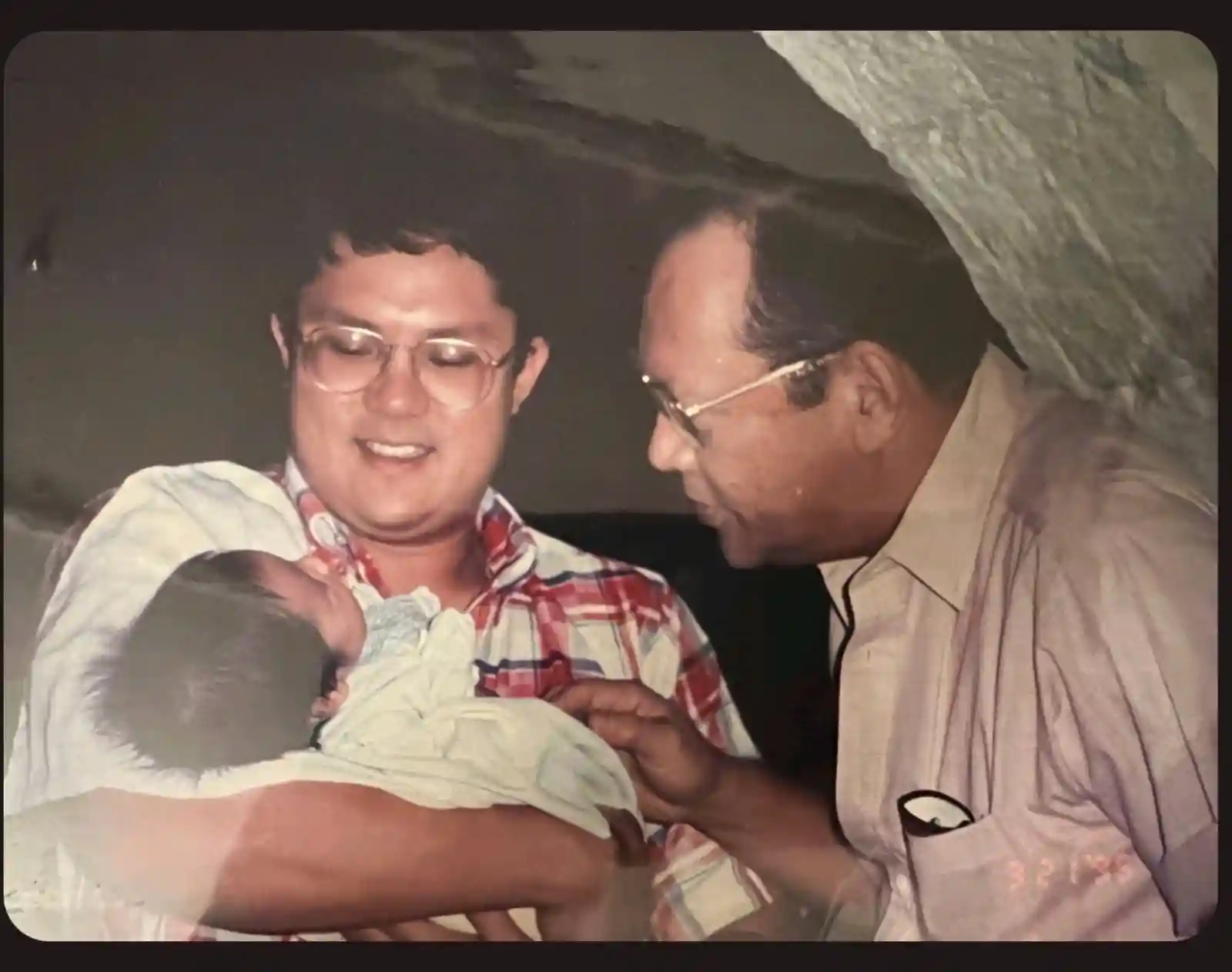 A newborn Jaime Cojuangco in the arms of his father Charlie and grandfather Danding