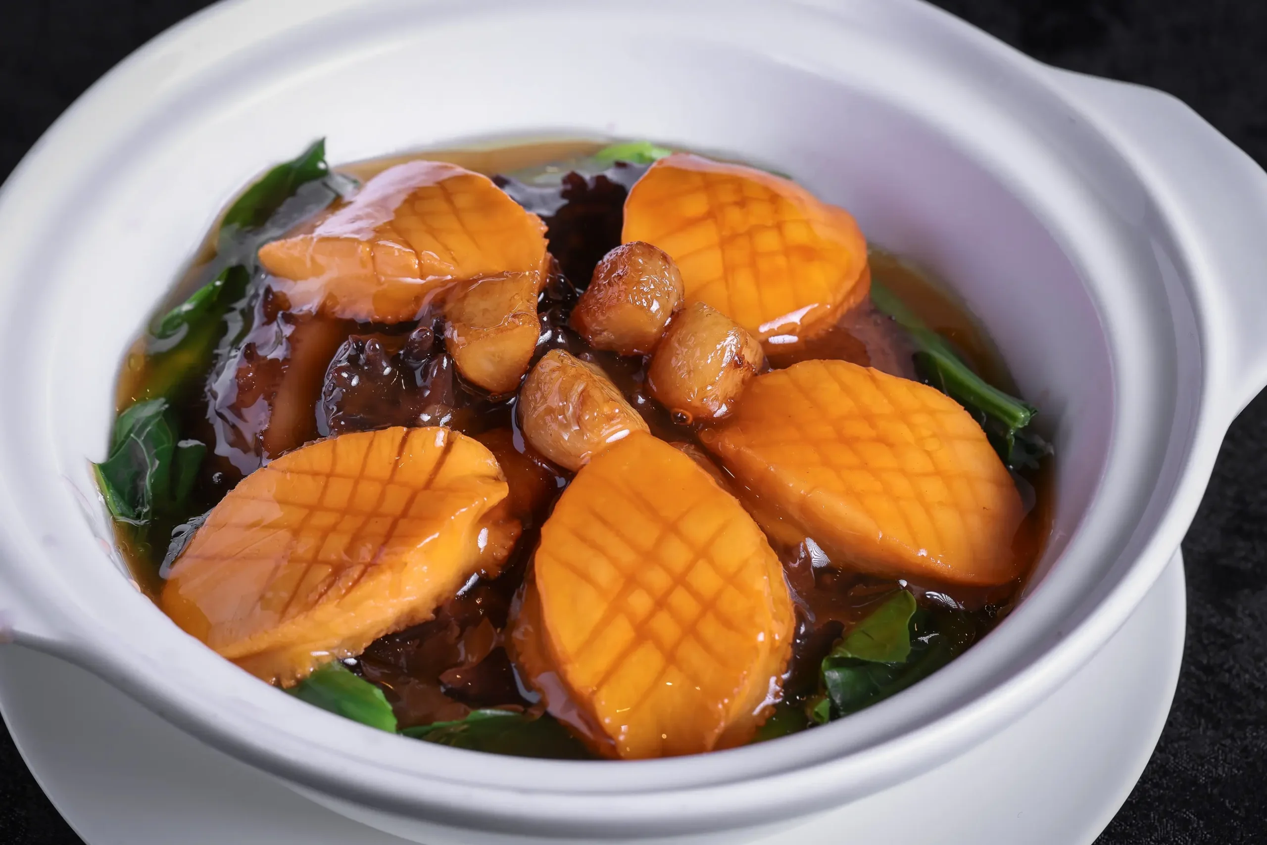 New ala carte menu items include this Braised 10 Head Abalone, Sea Cucumber, and Pork dish