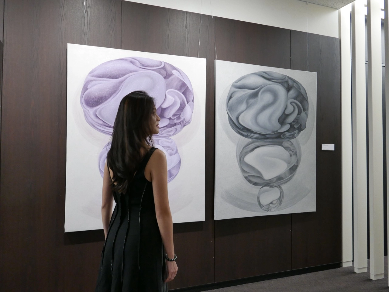 Filipina artist Maria Angelica Tan alongside her works