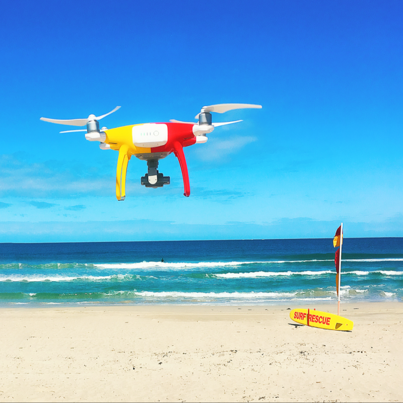 A patrol drone flying over a patrolled beach