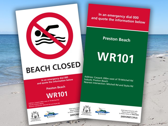 Beach closed and Beach Emergency Number signs for Preston Beach