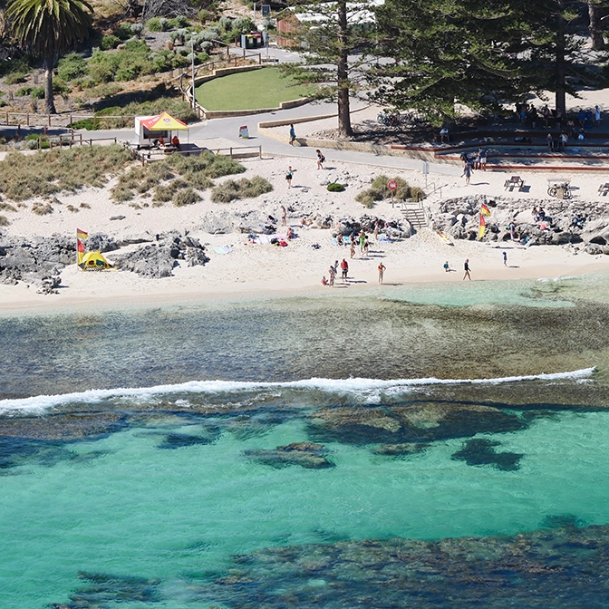 Aerial view of a busy patrolled beach at Rottnest Island