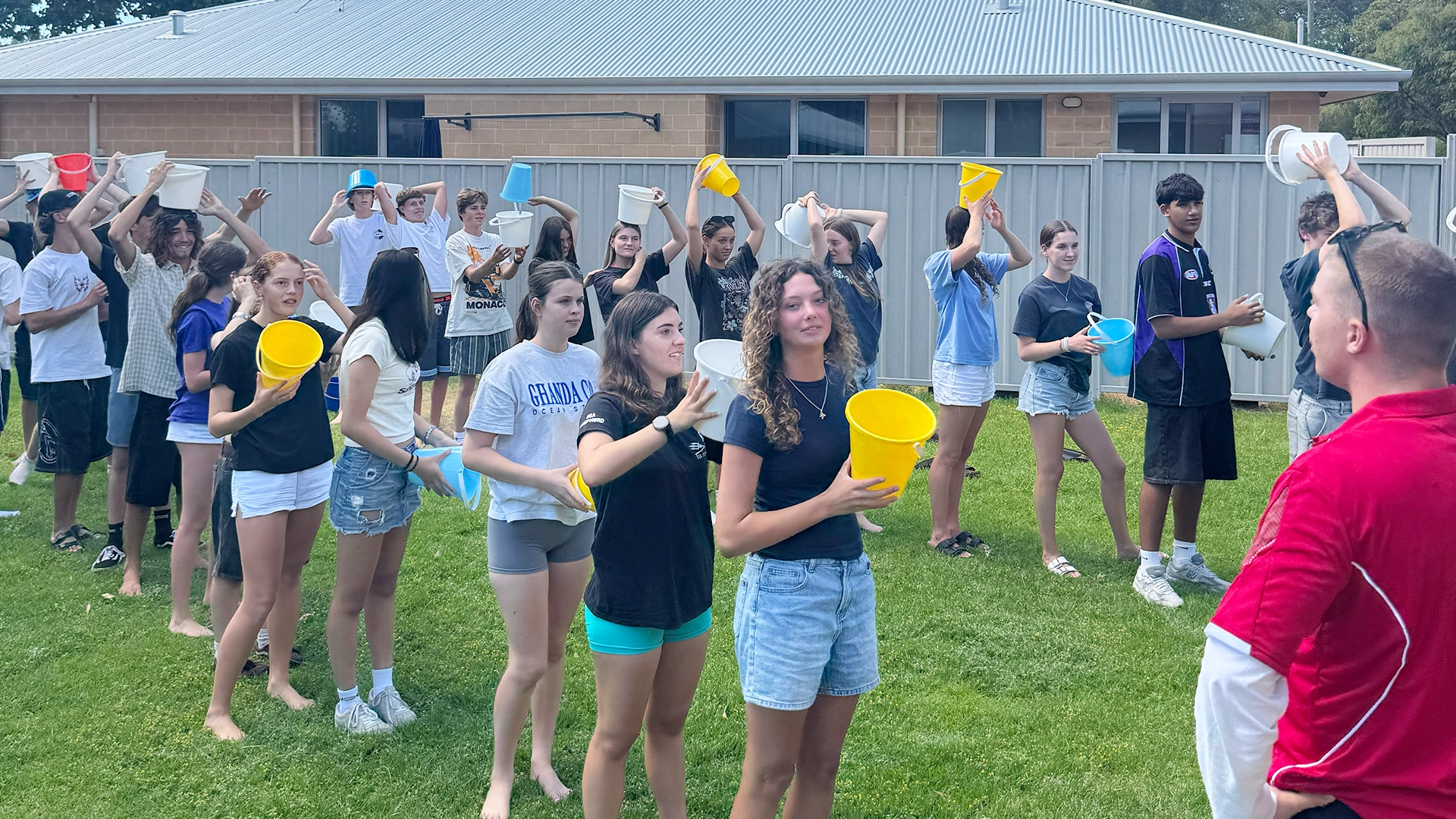Youth camp participants playing a lawn game