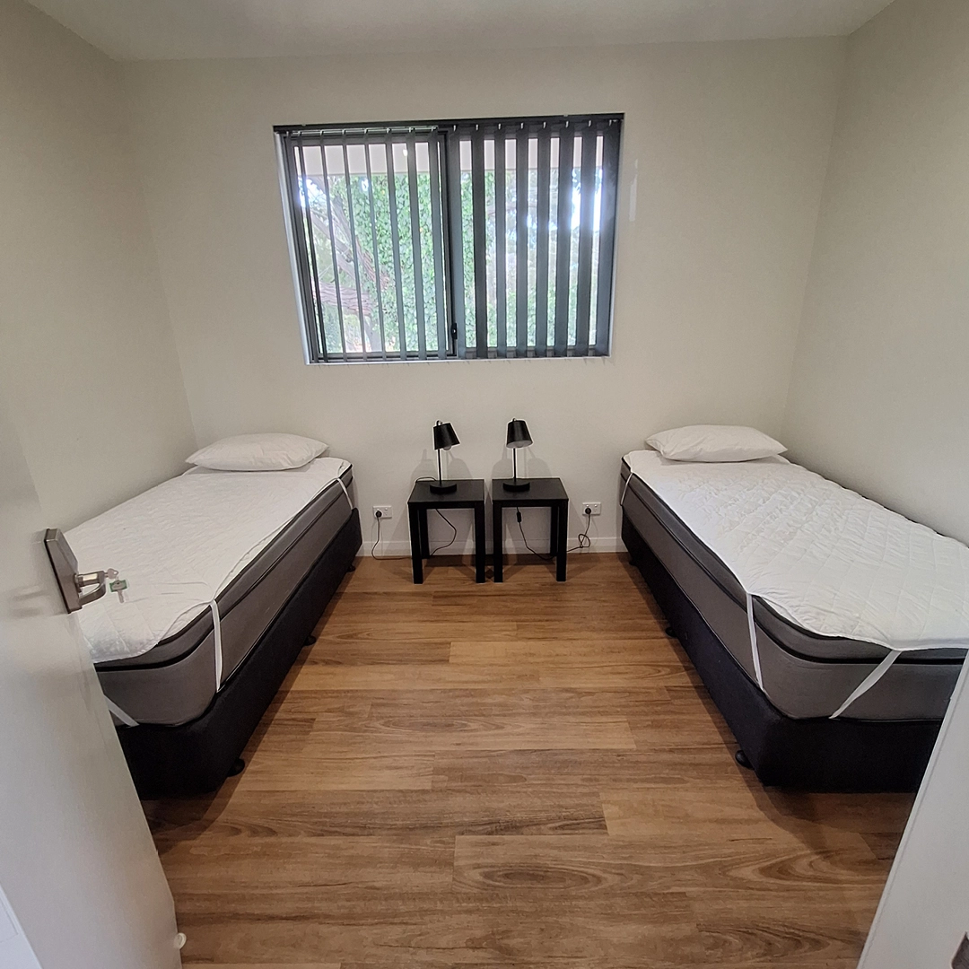 A twin bedroom at the South West Recreational Camp