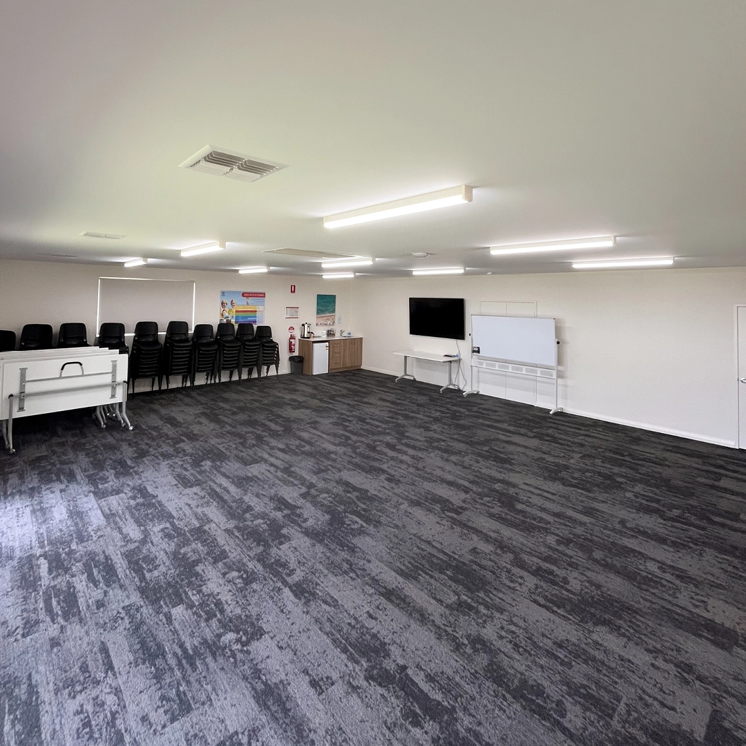 A function room set up with chairs at the South West Recreational Camp