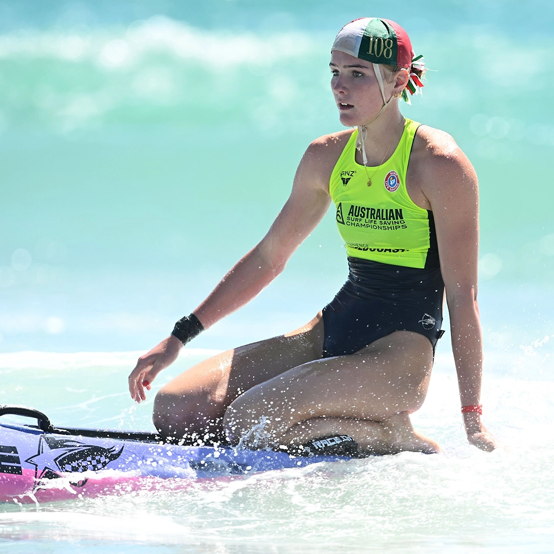 A surf sports competitor on the sand at a carnival