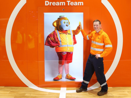 News. RTS. Resources Technology Showcase at the PCEC. Perth Convention and Exhibition Centre. Head of Technology BHP WA Iron Ore Jamie Bennett at the BHP Dream Team activation with a holgram of Fat Cat who is at the BHP building in Perth.
