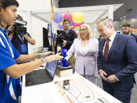 Rita Saffioti and Premier Roger Cook question an AI Robot "Who the best Premier is" which reluctantly answers them during the Resources Technology Showcase 2025 on Aug 19, 2025.