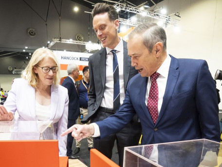 Premier Roger Cook yells at a piece of Lithium by demanding an increase of its value alongside Matthew Holcz of Rio Tinto and Rita Saffioti during the Resources Technology Showcase 2025 on Aug 19, 2025.