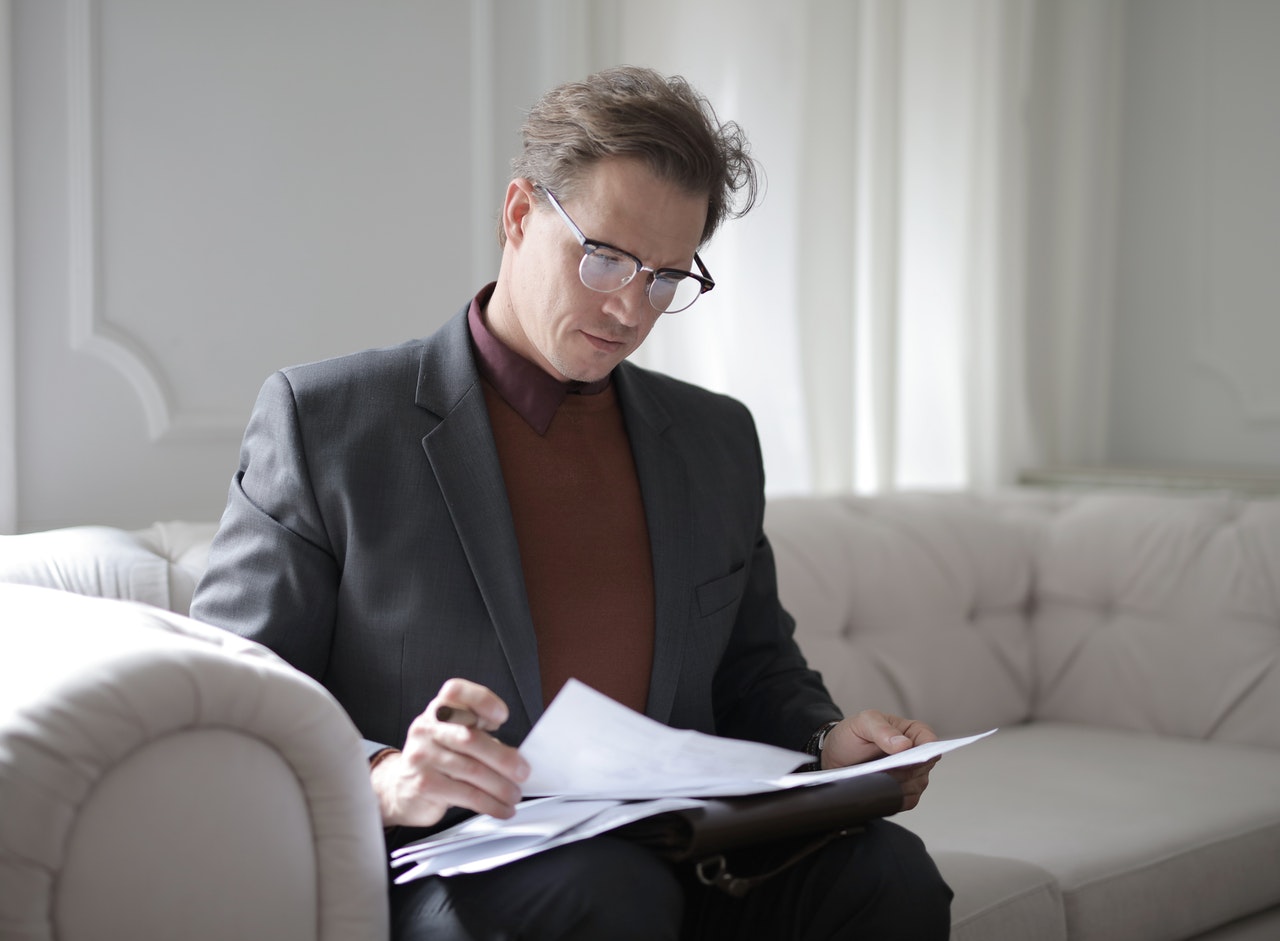 man reading business valuation report